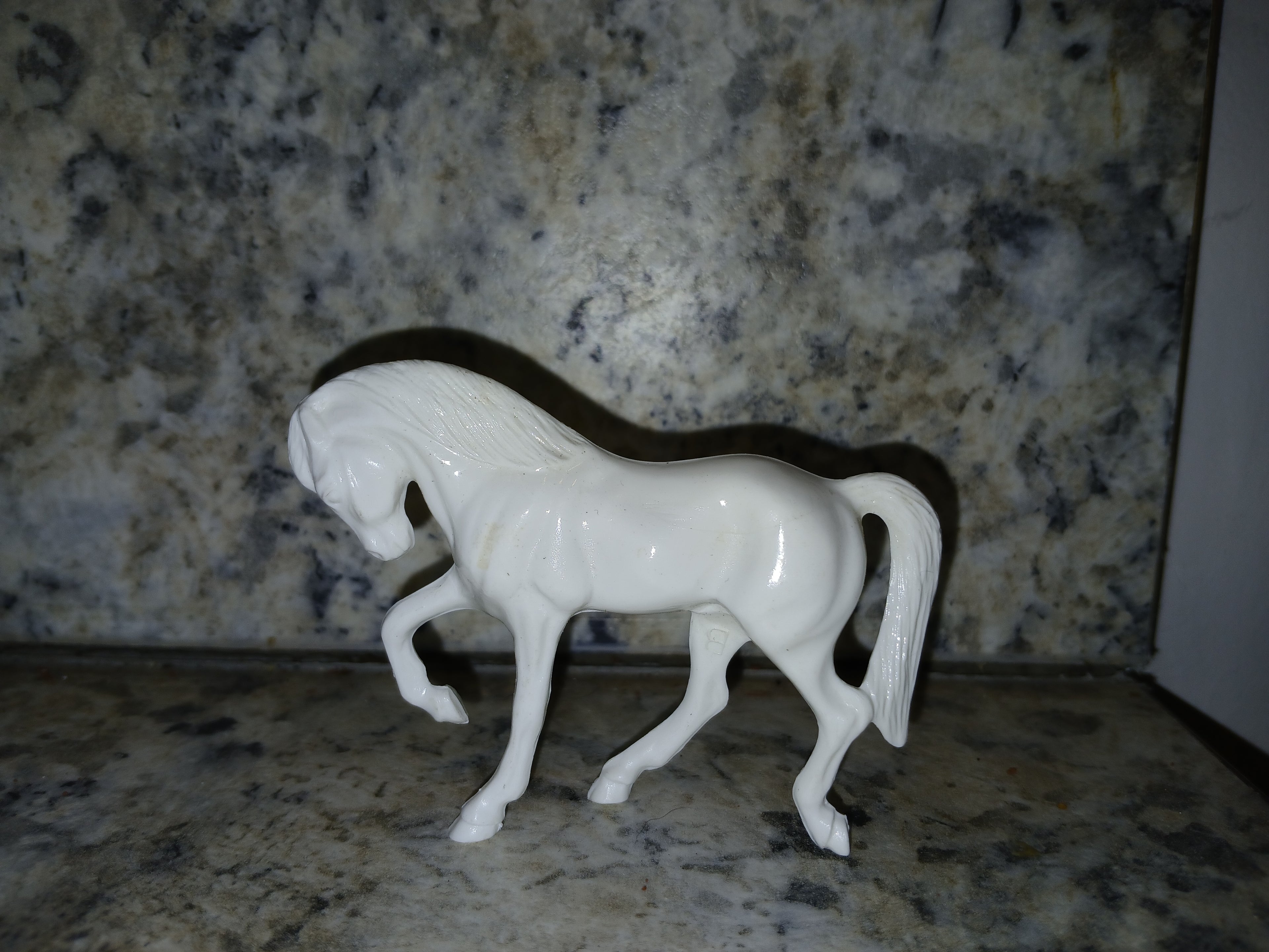 Unpainted Hartland Tinymite Quarter horse prancer